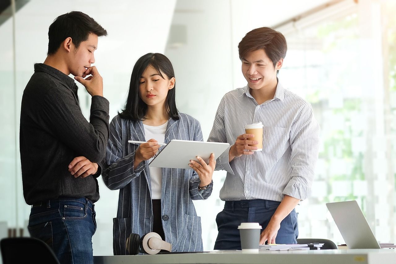 Business meeting between three people